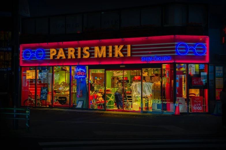 a colorful store with lit up windows and neon colors