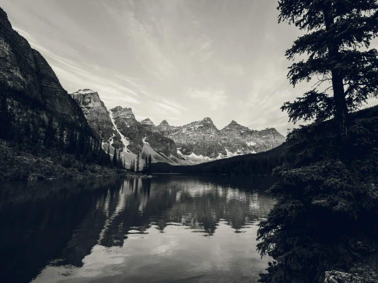 a mountain lake is seen in the background