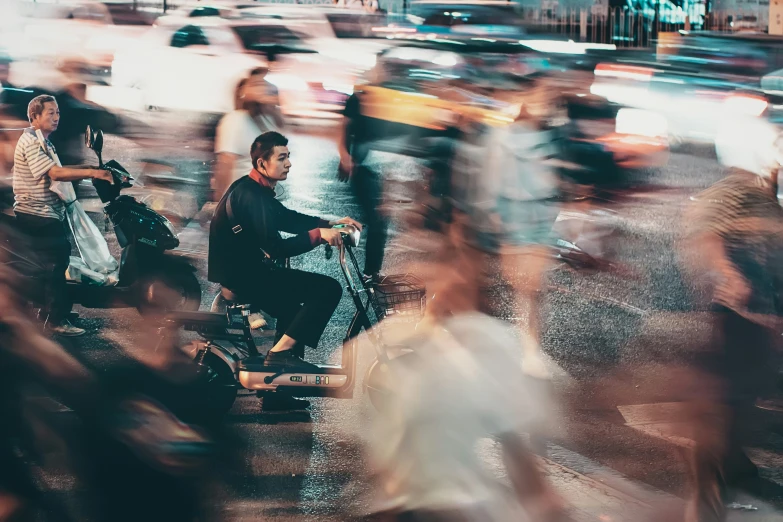 people are in the city by a road with cars