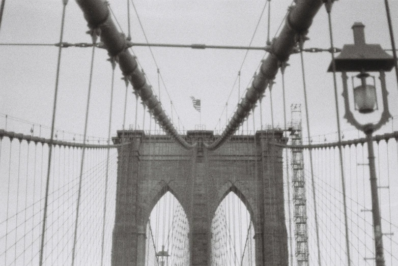 a person riding on the side of a bridge