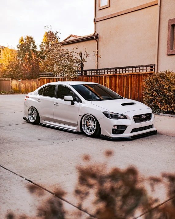 a car parked in a driveway in front of a home