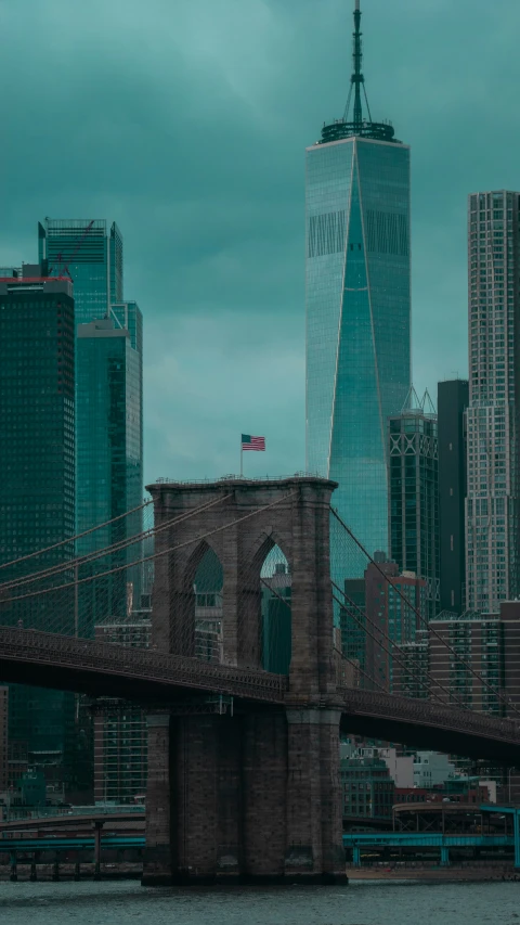 a building and a flag hanging from a bridge