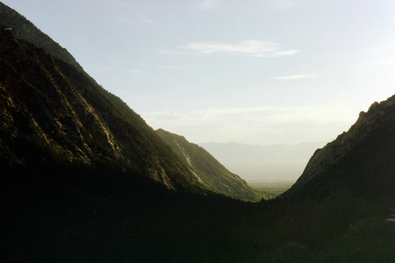 two mountains, and some trees in the foreground