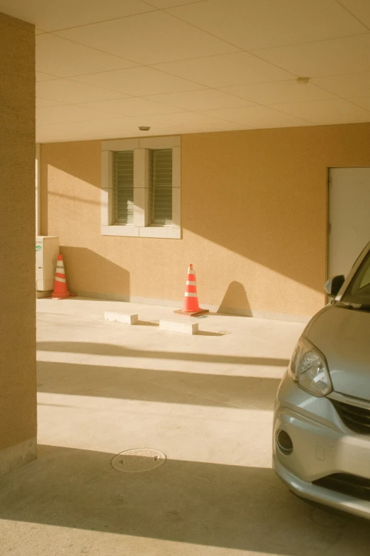 a car sits parked in front of a building