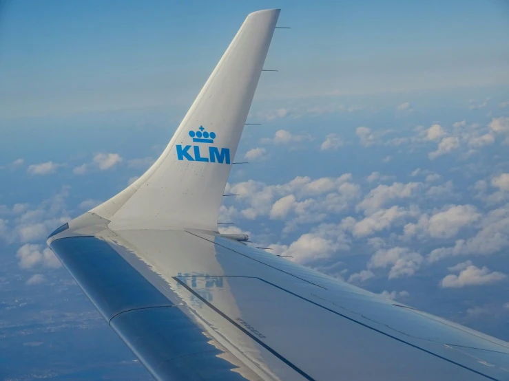 an airplane wing with the klm logo