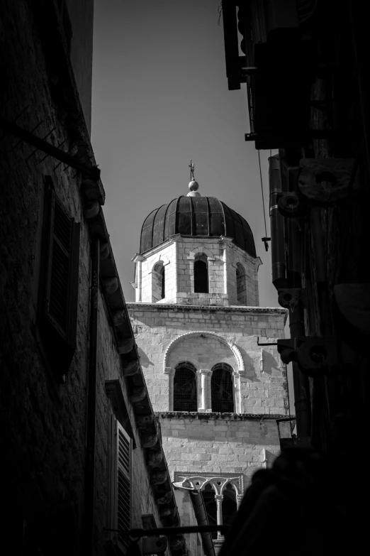 an old building with windows in black and white