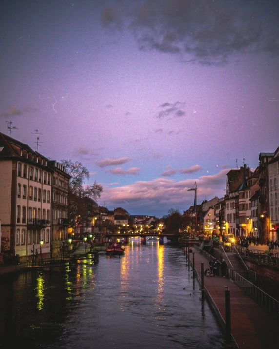 the river flowing through some small old town