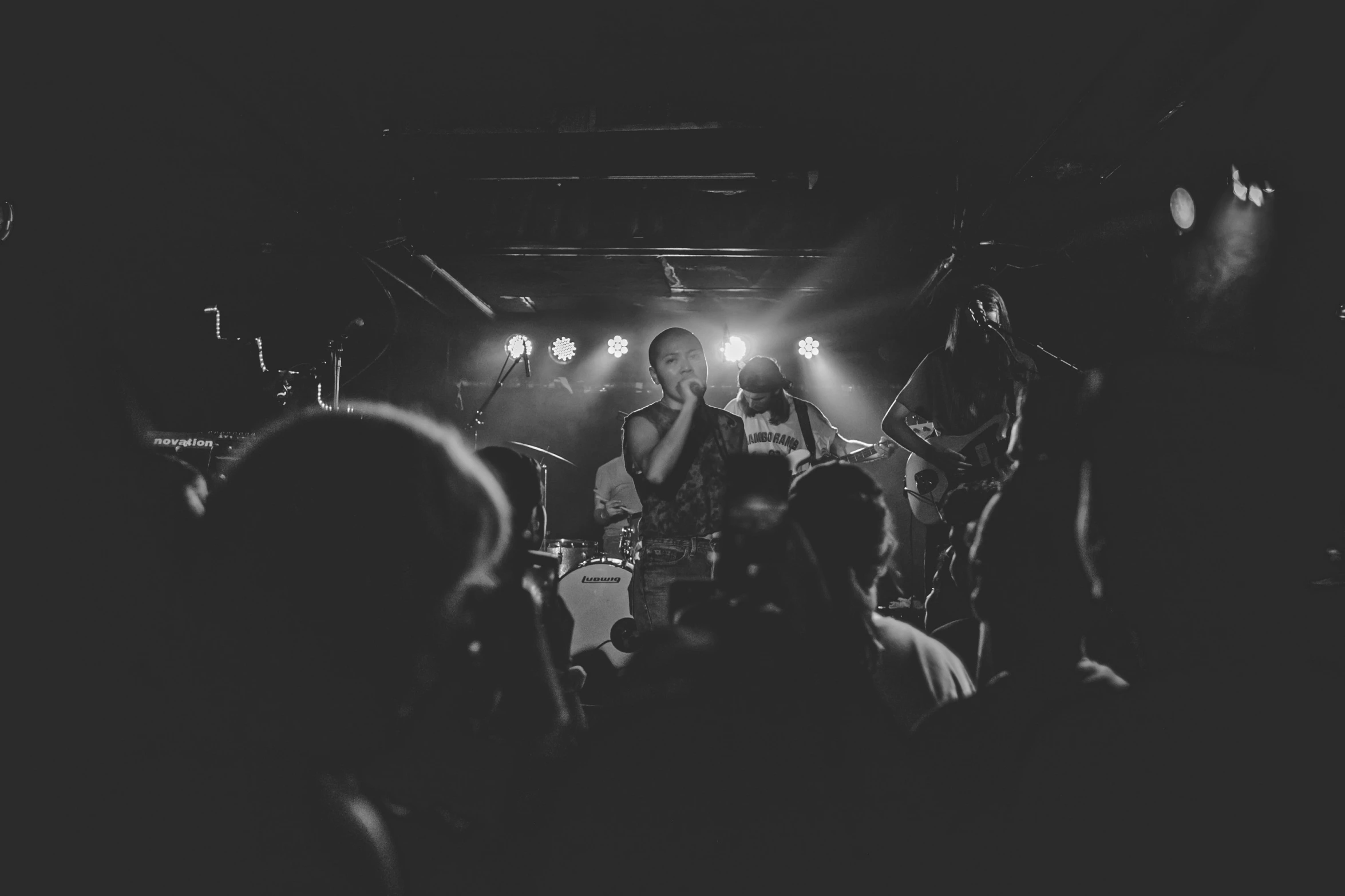 a black and white po of band performing on stage