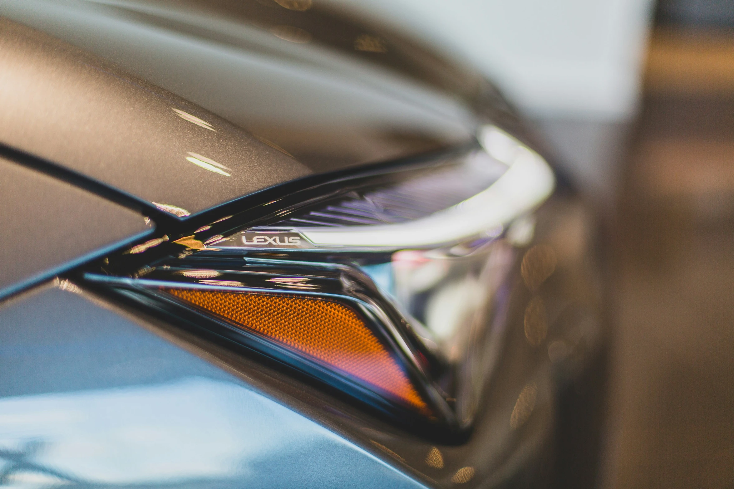 the front view mirror of a sleek car