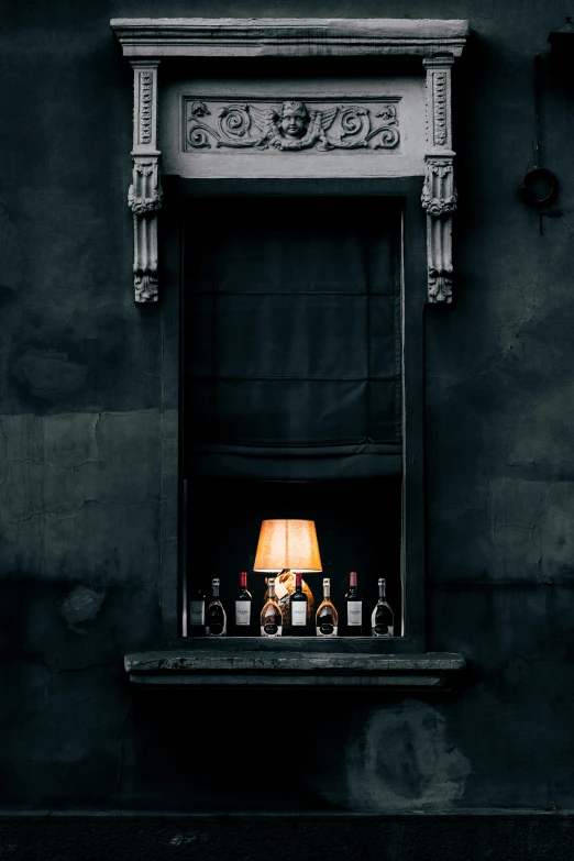 a lit fireplace with a small table lamp in the middle