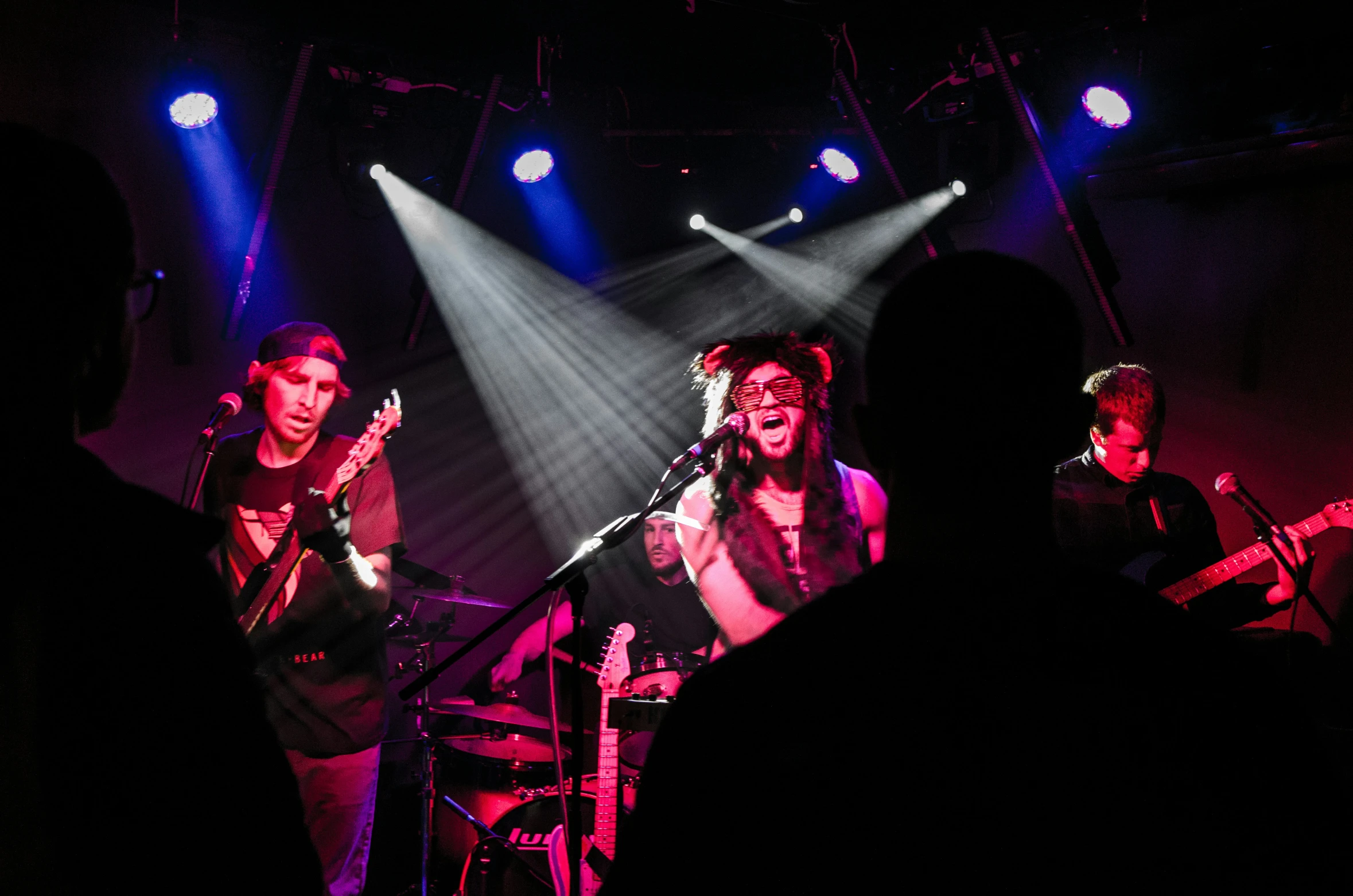 a couple of women on stage singing into microphones