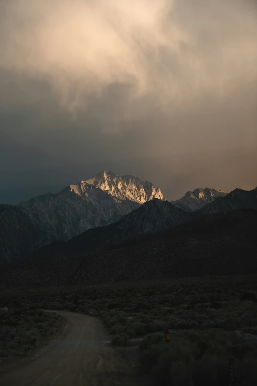 the sun rises over a mountain range in arizona