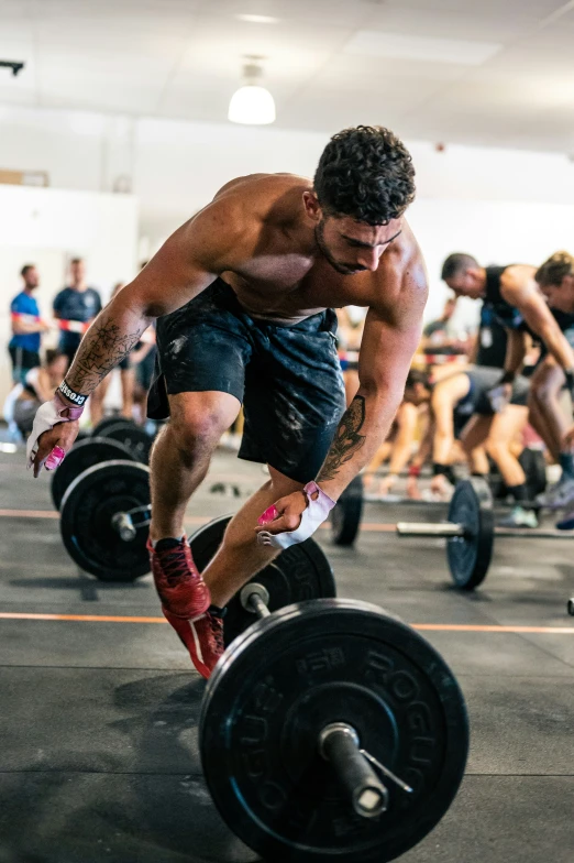 an athlete is performing a weightlift in the gym