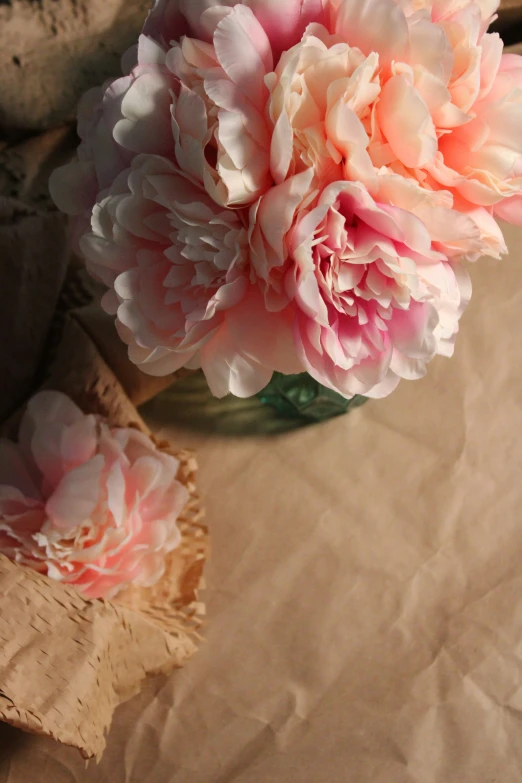 the large flower is pink on the table