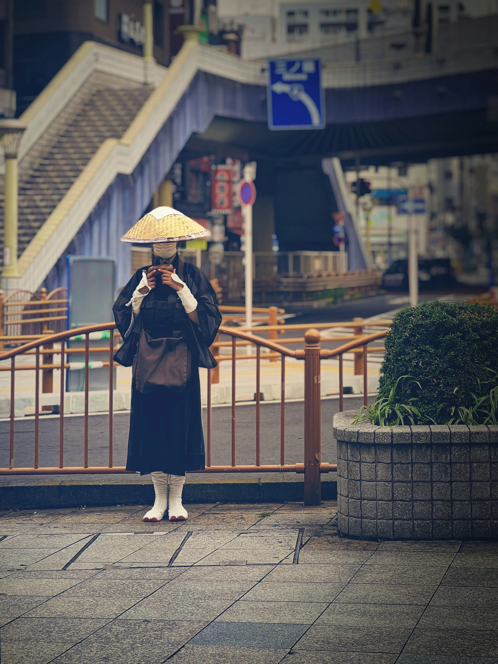 an older asian woman takes a po outside