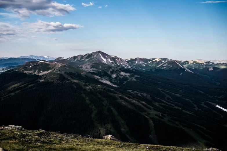 the mountains range are covered in snow