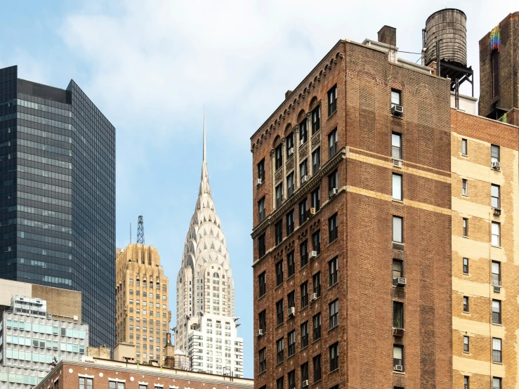 a group of large buildings that have towers and roofs