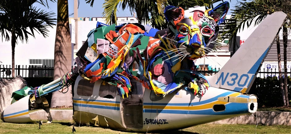 the big airplane is decorated with many colored objects