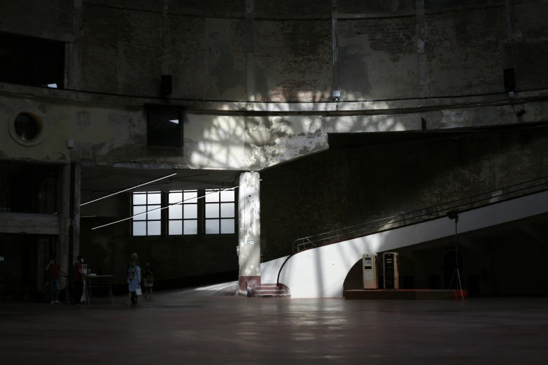 light shining in an empty building with stairs