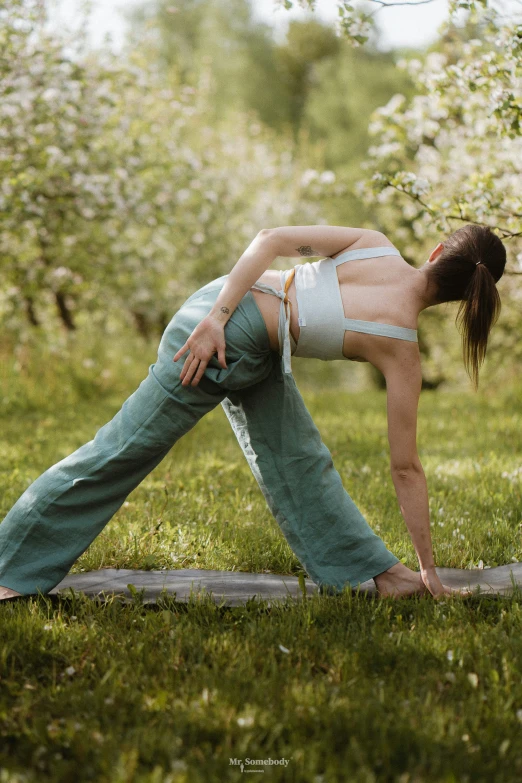 a person standing on their legs while doing yoga