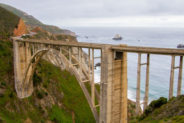 the view from a mountain top looking at an overpass