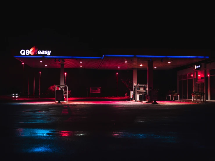 the gas station has red and blue lighting