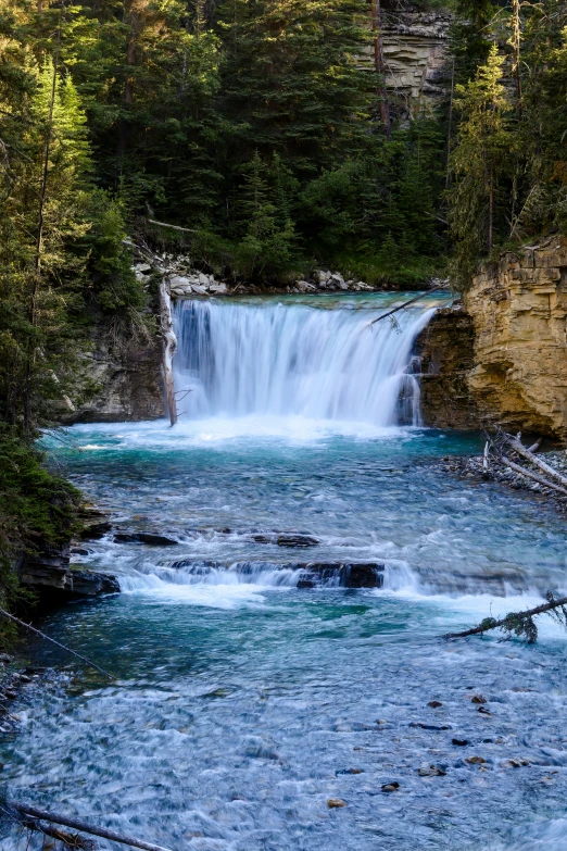 this is an image of waterfall in the wilderness