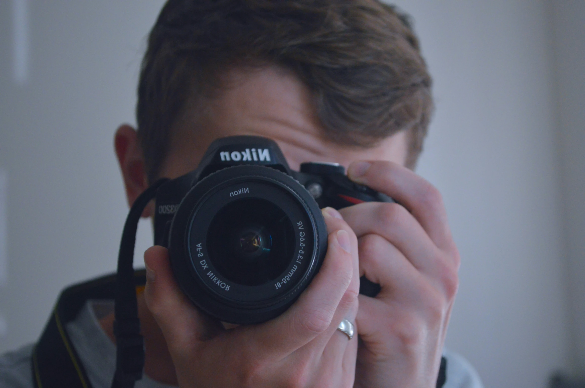 a man is holding up his camera to take a po