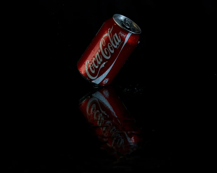 the can is sitting on a black table