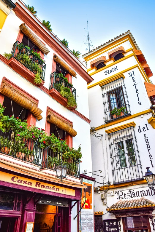 the facades of several old buildings with balconies