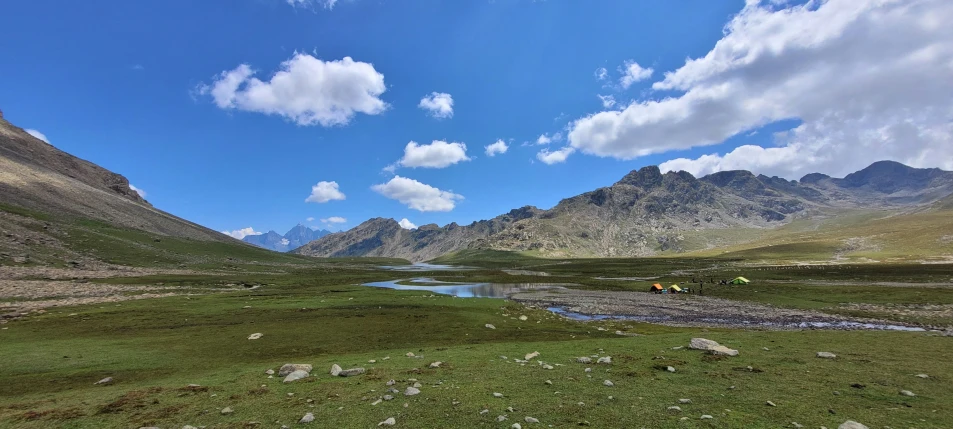 a small creek in the middle of a valley