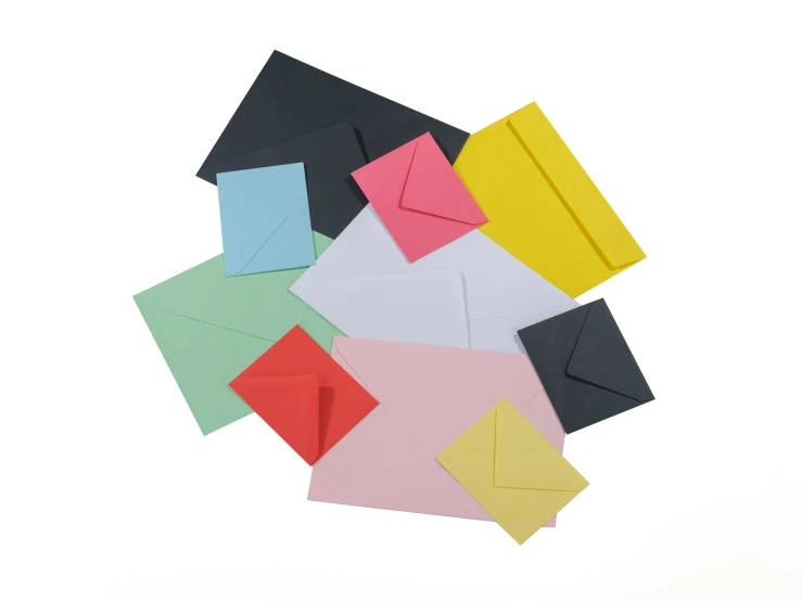 different colored cards and envelopes stacked on top of each other