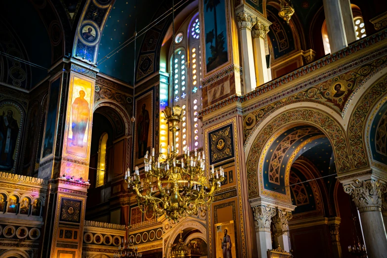 the interior of a cathedral with light pouring from it's windows