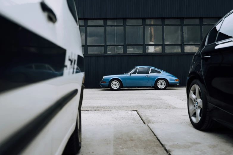 there are some cars parked in front of a garage