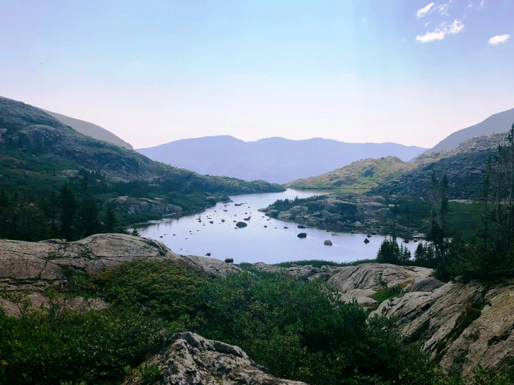 a mountain with a body of water in it