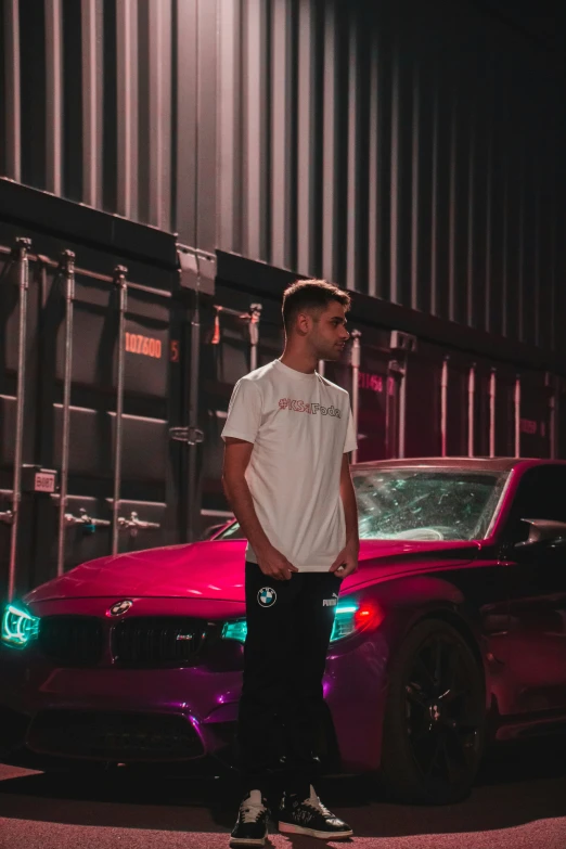 a young man is skateboarding near a red car