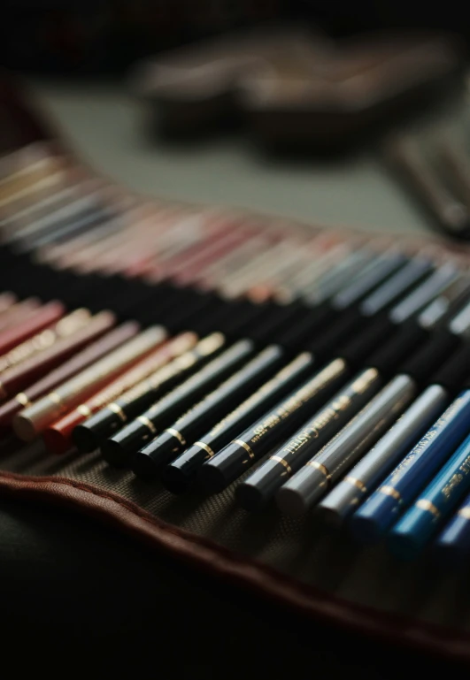 a collection of pens and markers laid out for display