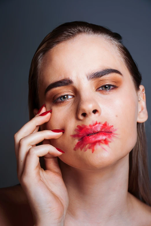 woman with dark skin, red lipstick and makeup