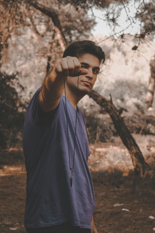 a young man taking a selfie with his phone