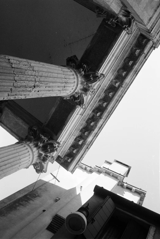 the top of some tall buildings on a cloudy day