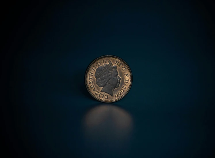 a round bronze coin is sitting on a table