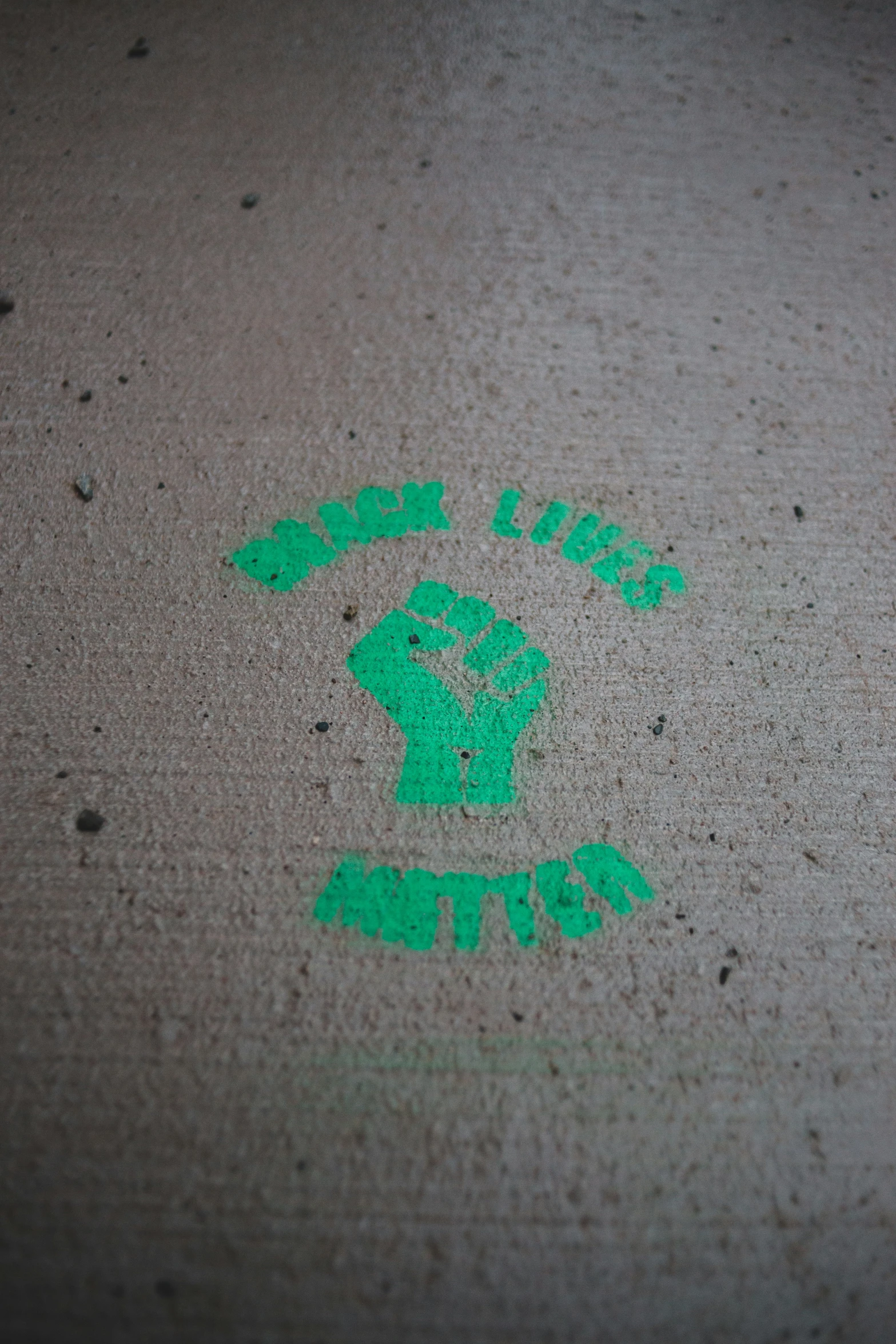 a sticker is on the sidewalk of a city street