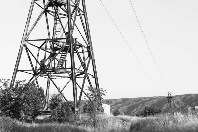 the view of an old water tower in black and white