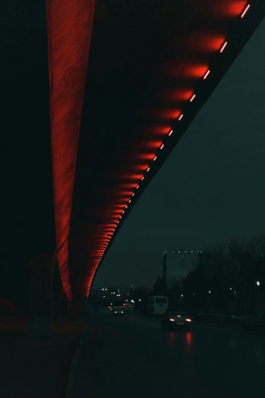 a bridge that is lit up in red lights