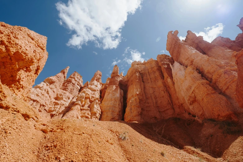 some rocks against the blue sky and some clouds