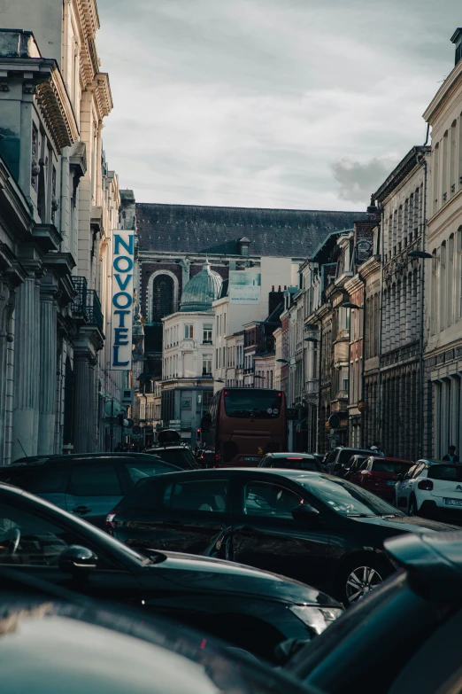 cars are parked in a line in the street