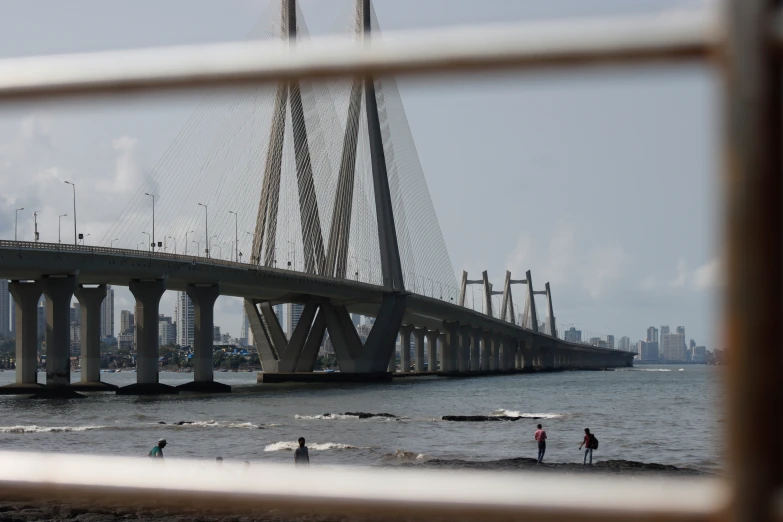 the bridge is across the water from the shore