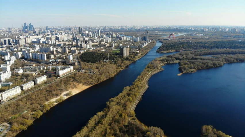 a river is surrounded by lots of trees in the city