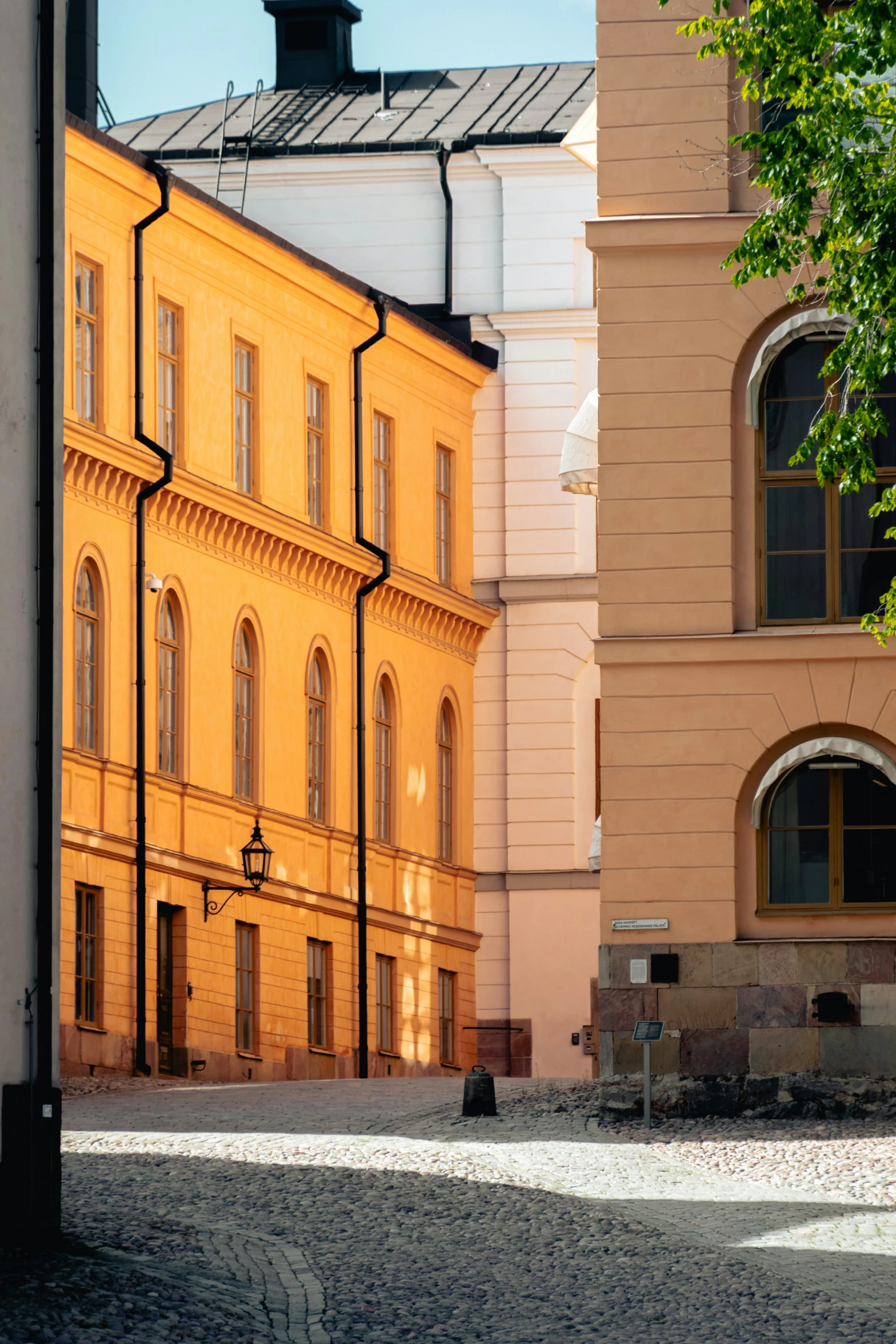 several buildings in a row with cobblestones