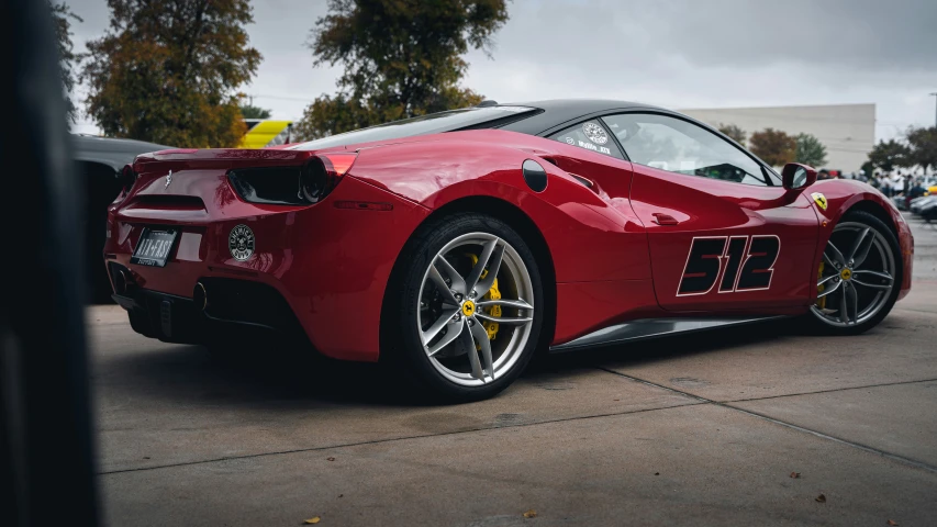 a red sports car sitting on top of a road